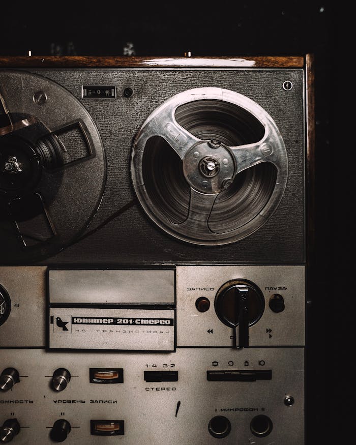 Close-up of a classic vintage reel-to-reel tape recorder showcasing retro audio equipment.